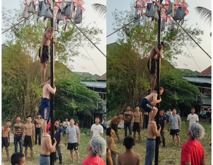 Serunya Panjat Pinang RT 25, “Bule” Rela Bergelut dengan Oli Demi Rebut Hadiah